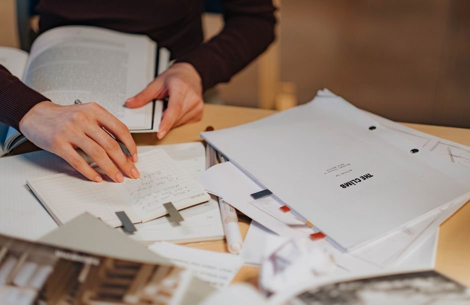 Notebook and pen on a writing desk
