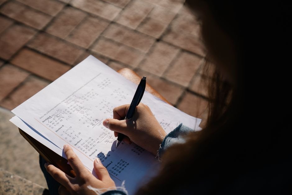 A student writing an exam paper